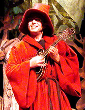 Personnage du conteur mandoliniste dans le spectacle de marionnettes pour enfants de Noël-en-Chocolat.